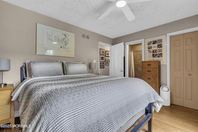 707 Cambridge Rd, Lanoka Harbor, NJ 08734 - bedroom with a textured ceiling, wood finished floors, and ceiling fan