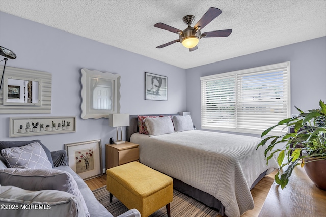 707 Cambridge Rd, Lanoka Harbor, NJ 08734 - bedroom with wood finished floors, a textured ceiling, and ceiling fan