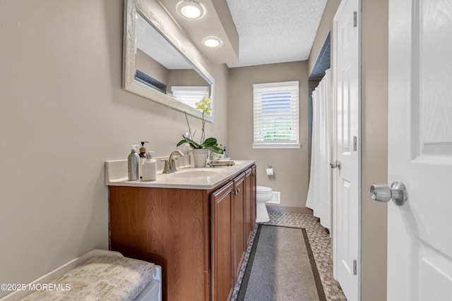 707 Cambridge Rd, Lanoka Harbor, NJ 08734 - full bathroom featuring double vanity and a textured ceiling