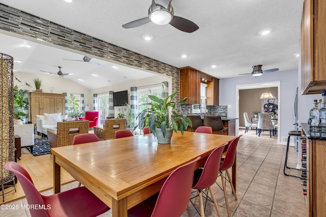 707 Cambridge Rd, Lanoka Harbor, NJ 08734 - dining room featuring a ceiling fan, light tile patterned floors, a textured ceiling, lofted ceiling, and recessed lighting