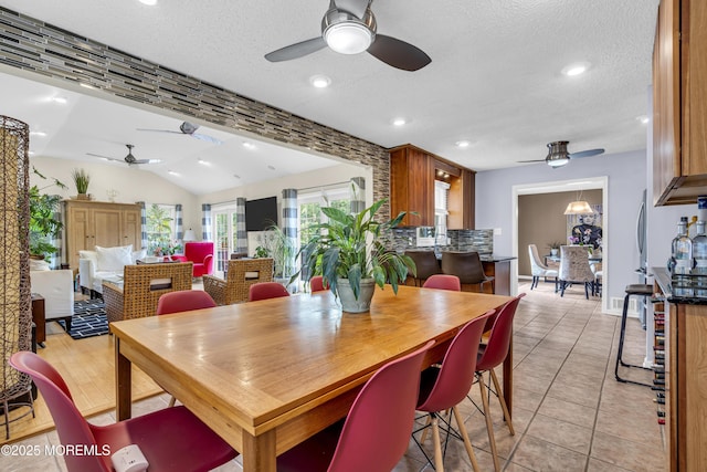 707 Cambridge Rd, Lanoka Harbor, NJ 08734 - dining area with a ceiling fan, light tile patterned flooring, a textured ceiling, vaulted ceiling, and recessed lighting