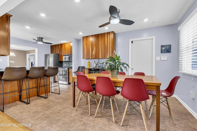 707 Cambridge Rd, Lanoka Harbor, NJ 08734 - dining room with a ceiling fan, a textured ceiling, light tile patterned floors, and recessed lighting