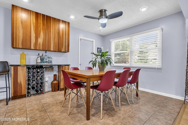 707 Cambridge Rd, Lanoka Harbor, NJ 08734 - dining room with a textured ceiling, ceiling fan, recessed lighting, and a bar