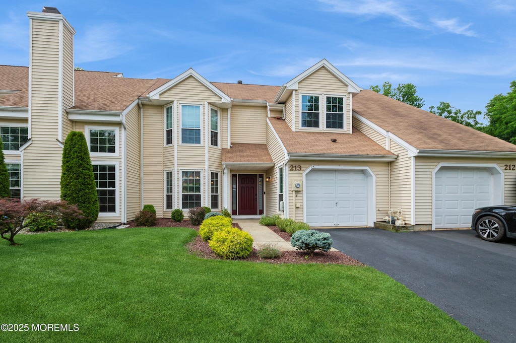 213 Daffodil Dr, Freehold, NJ 07728 - multi unit property with driveway, a front yard, roof with shingles, and a garage