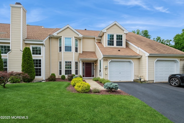 213 Daffodil Dr, Freehold, NJ 07728 - multi unit property with driveway, a front yard, roof with shingles, and a garage