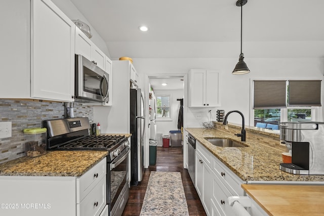908 S Concourse, Keyport, NJ 07735 - kitchen featuring stainless steel appliances, dark wood-style flooring, decorative backsplash, white cabinetry, and recessed lighting