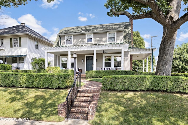 312 Lake Dr, Allenhurst, NJ 07711 - view of front facade with a porch, a front lawn, and ceiling fan