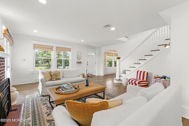312 Lake Dr, Allenhurst, NJ 07711 - living room with stairs, recessed lighting, arched walkways, and wood finished floors