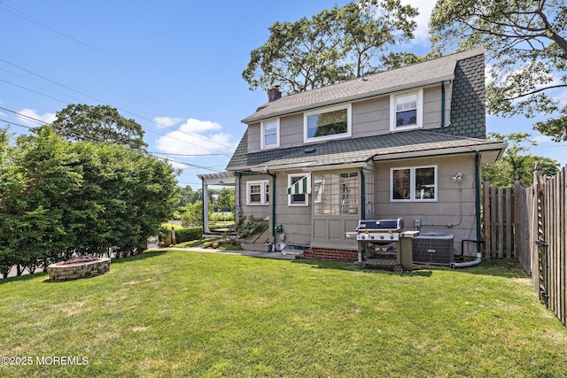 312 Lake Dr, Allenhurst, NJ 07711 - back of property with a chimney and a fire pit