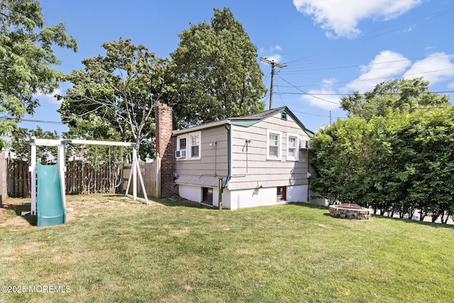 312 Lake Dr, Allenhurst, NJ 07711 - view of property exterior featuring an outdoor fire pit, a chimney, and a playground