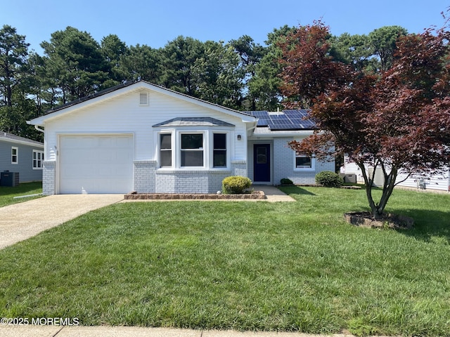 97 Yorkwood Dr, Brick, NJ 08723 - ranch-style house with brick siding, solar panels, concrete driveway, and a front lawn