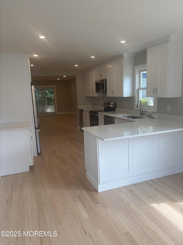 97 Yorkwood Dr, Brick, NJ 08723 - kitchen with stainless steel appliances, light wood-type flooring, light countertops, healthy amount of natural light, and recessed lighting