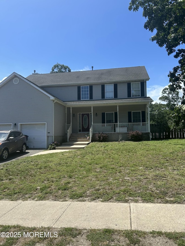 16 Aarons Way, Brick, NJ 08723 - view of front of home featuring covered porch, a garage, a front lawn, and driveway
