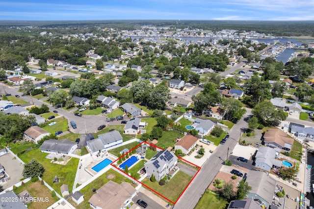 1020 Sarasota Dr, Forked River, NJ 08731 - aerial perspective of suburban area with property parcel outlined and a large body of water