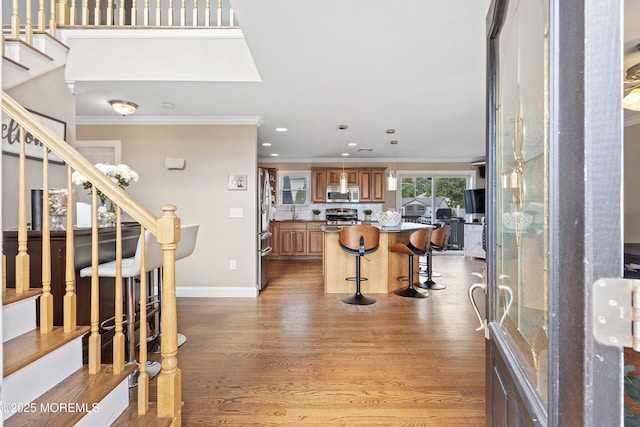 1020 Sarasota Dr, Forked River, NJ 08731 - foyer entrance with crown molding, stairway, recessed lighting, and light wood-style flooring