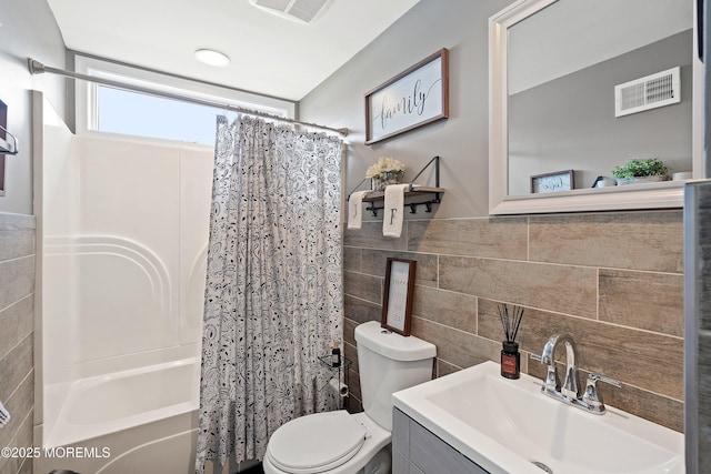 1020 Sarasota Dr, Forked River, NJ 08731 - bathroom with tile walls, shower / bathtub combination with curtain, and vanity