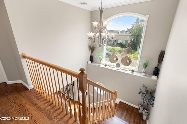 1020 Sarasota Dr, Forked River, NJ 08731 - staircase featuring wood finished floors, a chandelier, healthy amount of natural light, and crown molding