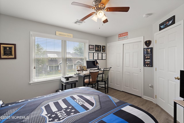 1020 Sarasota Dr, Forked River, NJ 08731 - bedroom with a closet, wood finished floors, an office area, and ceiling fan