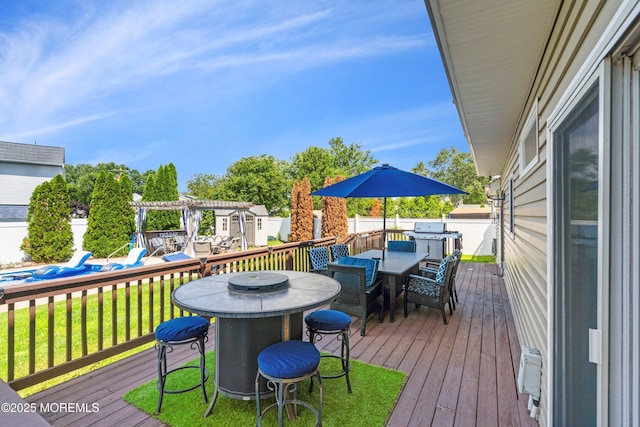 1020 Sarasota Dr, Forked River, NJ 08731 - deck with outdoor dining area, a pergola, and grilling area