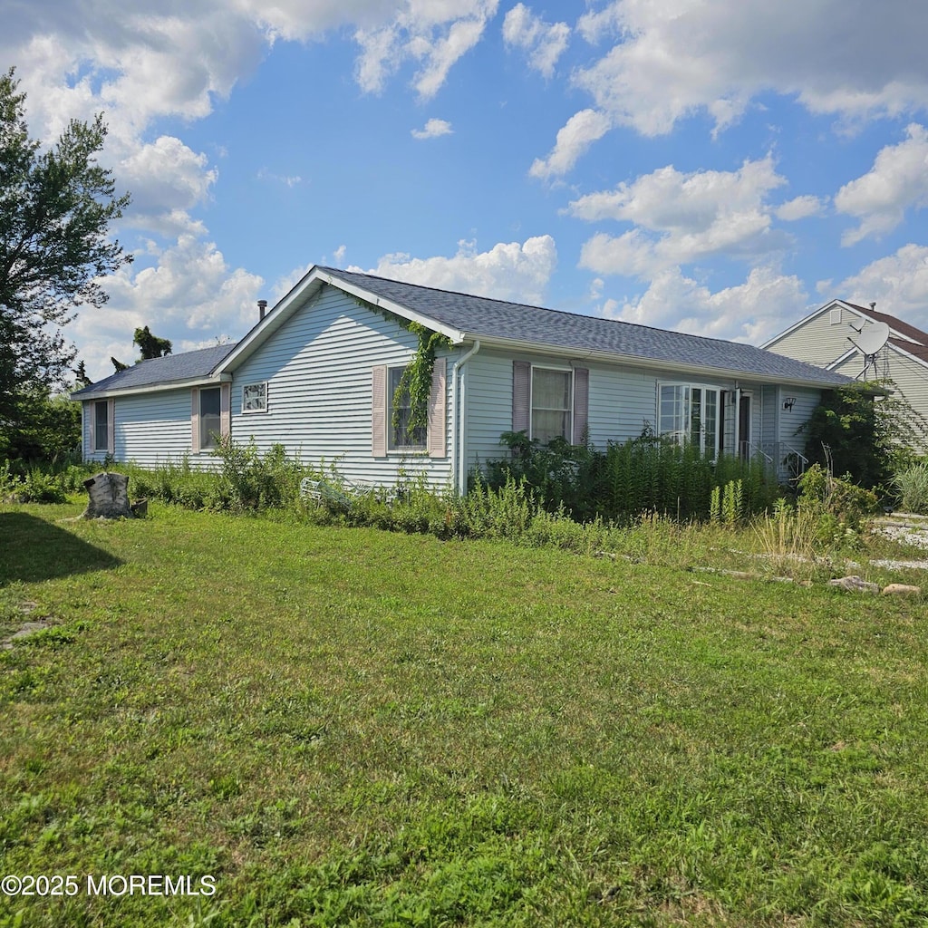 1701 Tamiami Rd, Forked River, NJ 08731 - view of property exterior with a lawn