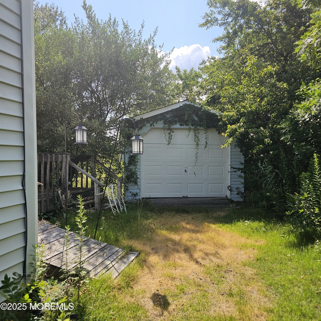 1701 Tamiami Rd, Forked River, NJ 08731 - detached garage featuring driveway