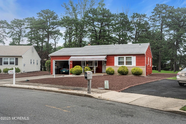 13 Millbrook Ct, Toms River, NJ 08757 - view of front facade with driveway and roof with shingles