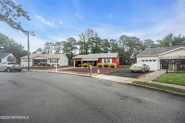 13 Millbrook Ct, Toms River, NJ 08757 - ranch-style house featuring asphalt driveway and an attached garage