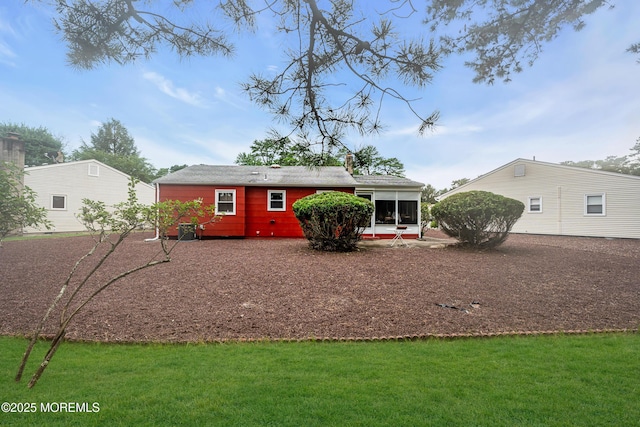 13 Millbrook Ct, Toms River, NJ 08757 - rear view of property with a sunroom, a yard, and a chimney