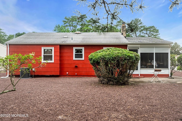 13 Millbrook Ct, Toms River, NJ 08757 - back of house featuring a chimney, roof with shingles, and a sunroom