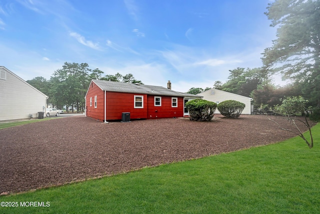 13 Millbrook Ct, Toms River, NJ 08757 - back of property with a yard and a chimney