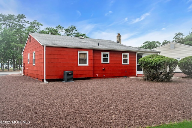 13 Millbrook Ct, Toms River, NJ 08757 - rear view of house with a chimney and roof with shingles