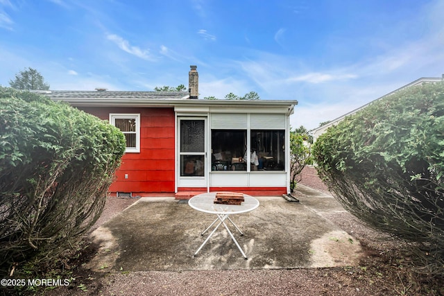 13 Millbrook Ct, Toms River, NJ 08757 - rear view of property featuring a chimney