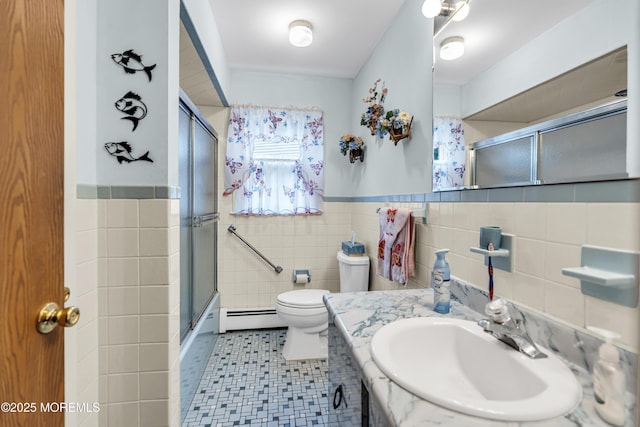 13 Millbrook Ct, Toms River, NJ 08757 - full bath featuring a baseboard heating unit, tile walls, vanity, wainscoting, and tile patterned floors