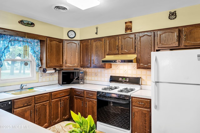 13 Millbrook Ct, Toms River, NJ 08757 - kitchen featuring black appliances, under cabinet range hood, light countertops, and backsplash