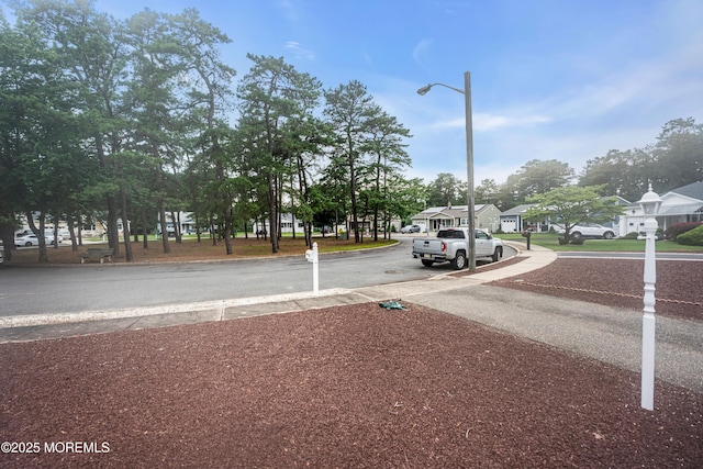 13 Millbrook Ct, Toms River, NJ 08757 - view of asphalt road with street lighting, curbs, and a residential view