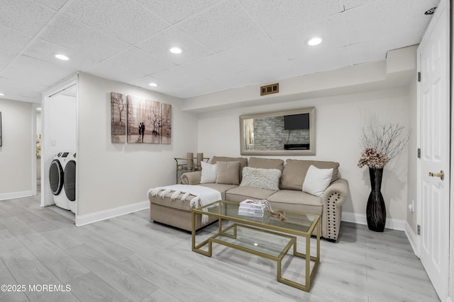 64 Scarlet Dr, Parlin, NJ 08859 - living area with washing machine and dryer, recessed lighting, a drop ceiling, and light wood-type flooring