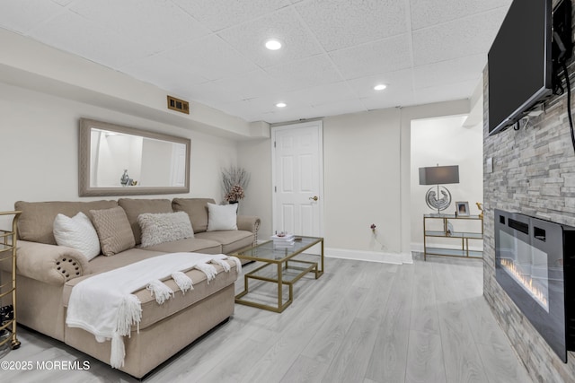 64 Scarlet Dr, Parlin, NJ 08859 - living room with light wood-style flooring, a fireplace, recessed lighting, and a drop ceiling