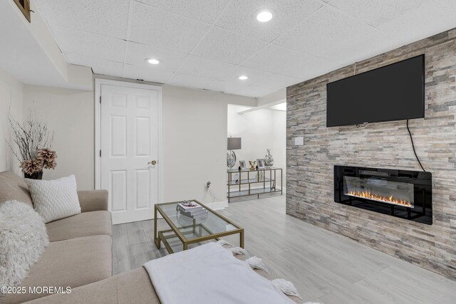64 Scarlet Dr, Parlin, NJ 08859 - living room with a fireplace, wood finished floors, a paneled ceiling, and recessed lighting