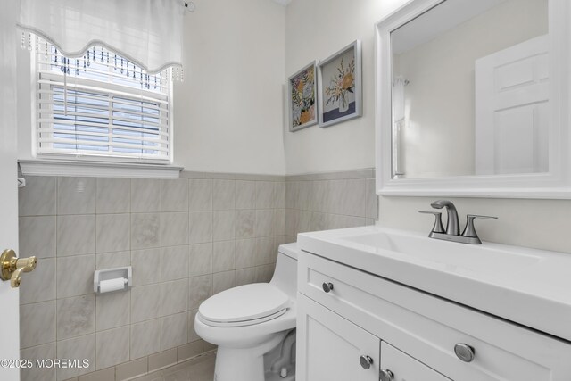 64 Scarlet Dr, Parlin, NJ 08859 - bathroom with vanity, tile walls, tile patterned floors, and wainscoting
