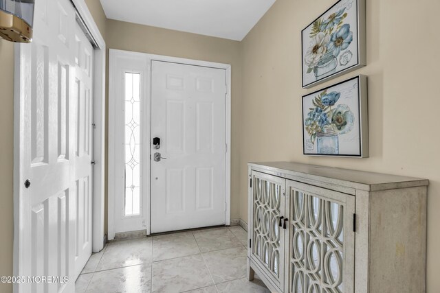 64 Scarlet Dr, Parlin, NJ 08859 - entryway featuring light tile patterned floors and baseboards