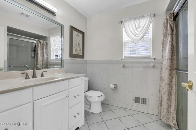 64 Scarlet Dr, Parlin, NJ 08859 - bathroom featuring tile walls, tile patterned floors, vanity, healthy amount of natural light, and curtained shower