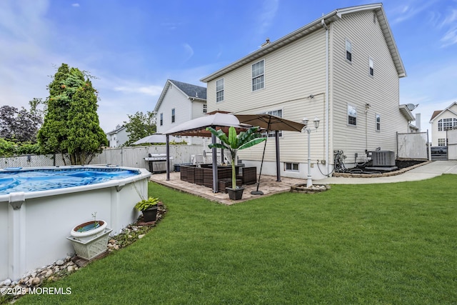 64 Scarlet Dr, Parlin, NJ 08859 - rear view of house featuring a fenced backyard and a patio area