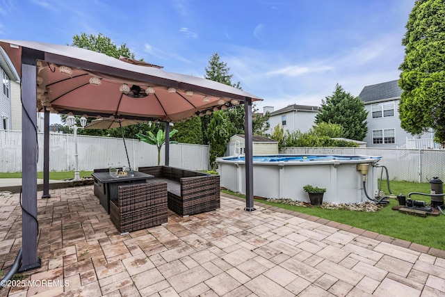 64 Scarlet Dr, Parlin, NJ 08859 - fenced backyard with a gazebo, a shed, a patio, and an outdoor living space with a fire pit