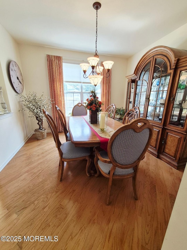 17 Marigold Ln, Little Egg Harbor, NJ 08087 - dining area with a chandelier and light wood-type flooring
