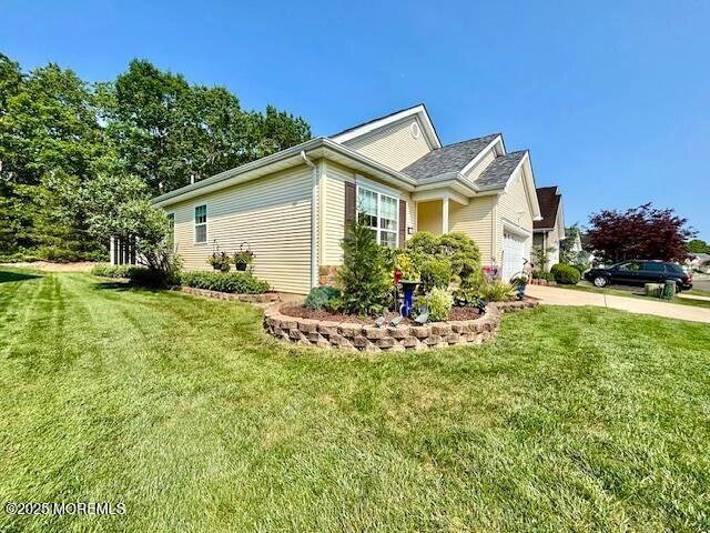 17 Marigold Ln, Little Egg Harbor, NJ 08087 - view of home's exterior with a garage, a lawn, and driveway