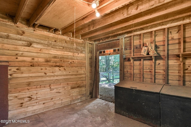 147 Montrose Rd, Colts Neck, NJ 07722 - interior space featuring wood walls and unfinished concrete floors