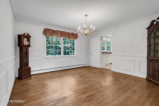 147 Montrose Rd, Colts Neck, NJ 07722 - unfurnished dining area with baseboard heating, a chandelier, a decorative wall, crown molding, and wainscoting