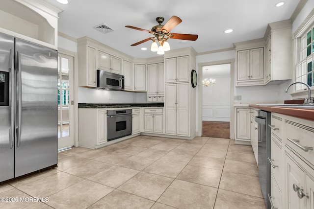 147 Montrose Rd, Colts Neck, NJ 07722 - kitchen featuring appliances with stainless steel finishes, a ceiling fan, recessed lighting, light tile patterned floors, and a chandelier