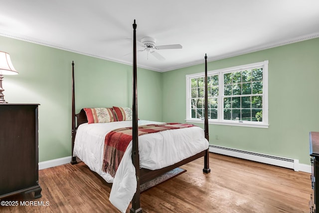 147 Montrose Rd, Colts Neck, NJ 07722 - bedroom featuring a baseboard radiator, wood finished floors, ceiling fan, and ornamental molding