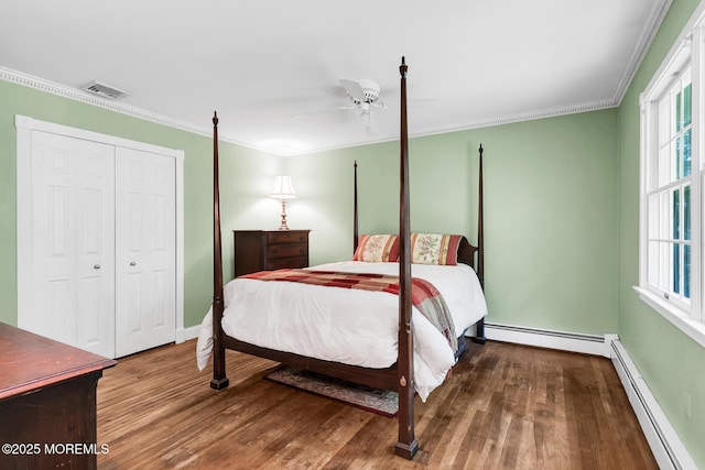 147 Montrose Rd, Colts Neck, NJ 07722 - bedroom featuring a baseboard radiator, wood finished floors, ornamental molding, and multiple windows
